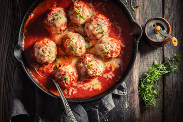 Spicy meatballs with tomato sauce and cheese