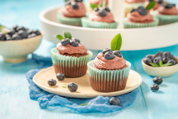 Fresh muffin made of chocolate cream and berries