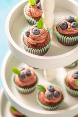 Sweet muffin made of chocolate cream and berries