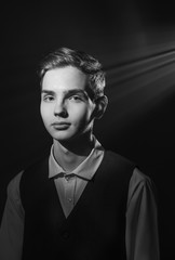 Portrait of a beautiful teenager in strict clothes with authentic appearance in vintage style