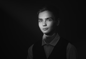 Portrait of a beautiful teenager in strict clothes with authentic appearance in vintage style