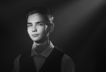 Obraz premium Portrait of a beautiful teenager in strict clothes with authentic appearance in vintage style