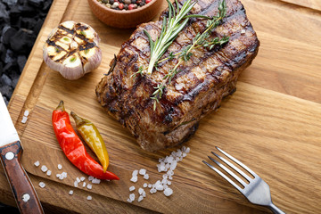 steak grilled over charcoal