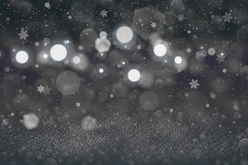 Fototapeta na wymiar cute brilliant glitter lights defocused bokeh abstract background with falling snow flakes fly, holiday mockup texture with blank space for your content