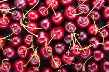 sweet red cherries as background.