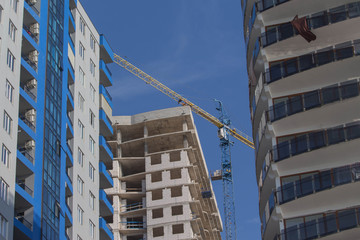 Modern apartment buildings exteriors in sunny day. Skyscraper in Downtown city