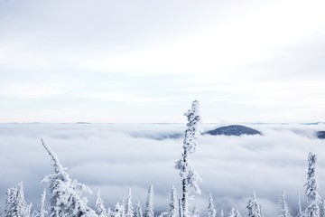 Snow-covered nature of Sheregesh with icy lift at the ski resort.