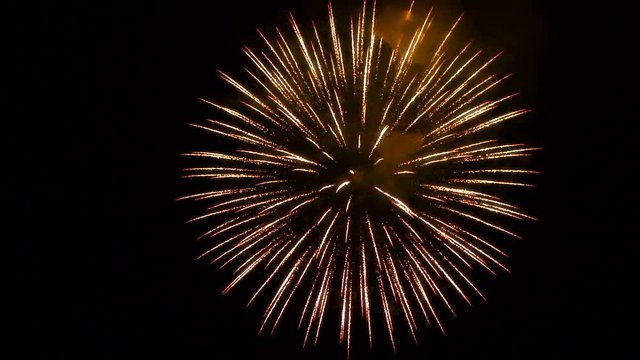 Festive single fireworks in the night sky