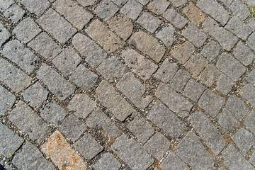 Textured beautiful stone pavement photographed close-up.