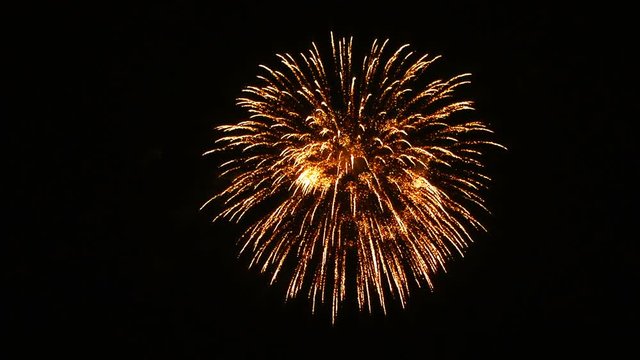 Festive single fireworks in the night sky