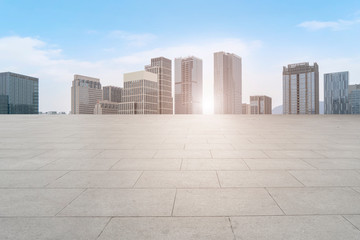 Obraz premium Urban skyscrapers with empty square floor tiles