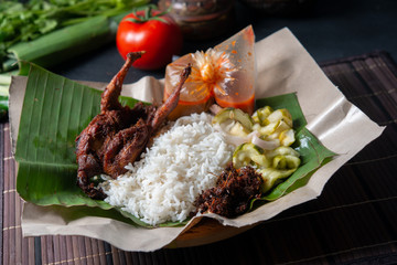 Nasi lemak kukus with quail