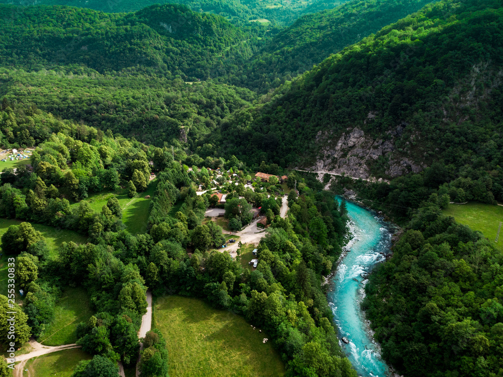 Wall mural soca river valley in green spring forest,aerial view - Wall murals