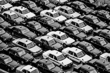 Many taxis waiting for customers at a station