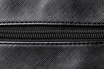 Artificial leather handbag texture. Black textile zipper background. © Paweł Michałowski