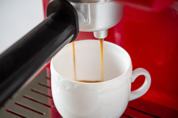 Making coffee with espresso machine. Closeup, selective focus