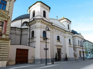 Fototapeta na wymiar Slovakia, Kosice - May 2, 2018: Evangelical or Protestant Church in Kosice. Oval church building with inscription 'Soli Deo Gloria' above the entrance in neoclassical style on Mlynska (Mill) Street