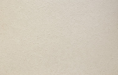 Photo of old gray cement wall with fractures.