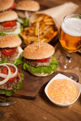 Spicy sesame souce with delicious beef burgers and beer