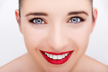 Beautiful young model with red lips and white teeth. Gorgeous Woman Face.