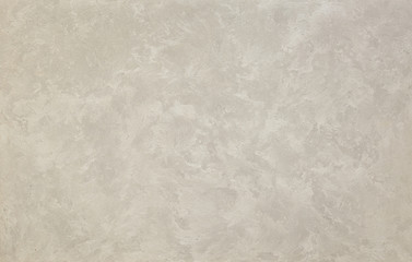 Photo of old gray cement wall with fractures.