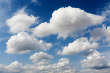 Naklejka na ściany i meble Blue sky with clouds on a sunny day.