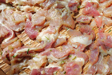 Thai people dry pork mixed with herb and some ingredients outdoor before cooking