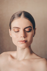 Beautiful portrait of young woman with nude makeup