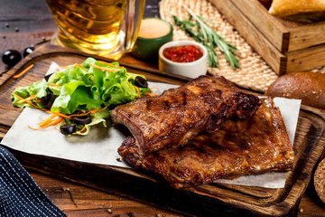 Grilled meat with vegetables on the background