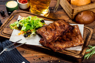 Grilled meat with vegetables on the background