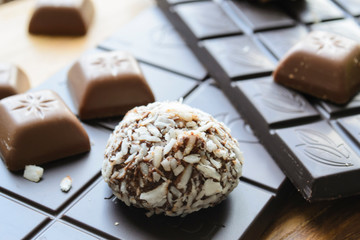 chocolates, black chocolate, coconut chips close up