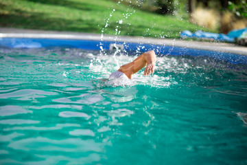 man practicing swimming