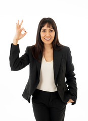 Obraz premium Portrait of young beautiful smiling business woman doing all OK sign Isolated on white background
