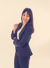 Portrait of a young beautiful and confident business woman smiling. Isolated on white background.