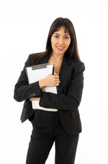 Portrait of a young beautiful and confident business woman smiling. Isolated on white background.