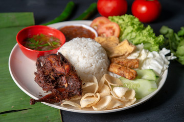 Nasi lemak kukus with quail meat