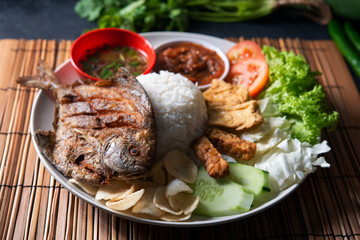 Fried pomfret fish and rice