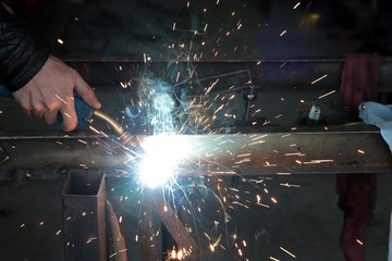 Electric wheel grinding on steel structure in factory .turkey 