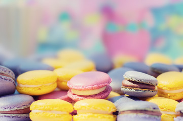 Colorful french macaroons background.  Colorful french cookies shallow dof,  selective focus.
