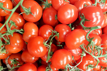 Fresh delicious red tomatoes in Summer tray market agriculture farm full of organic for background