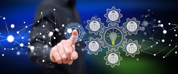 Man touching a teamwork idea concept