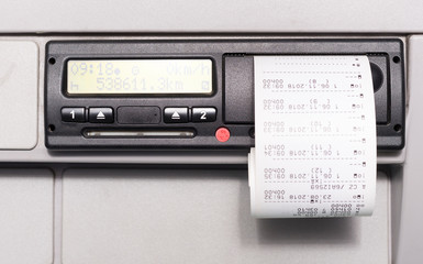 Obraz premium Digital tachograph and print of the driving time of the day. No personal data