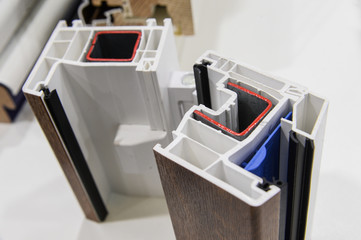 demonstration of opening and closing of plastic and wooden windows on a sample of profiles....