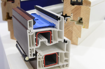 demonstration of opening and closing of plastic and wooden windows on a sample of profiles....