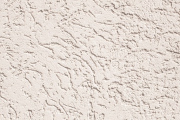 Photo of the concrete wall of the house with rubbing. Sunny day. Texture background