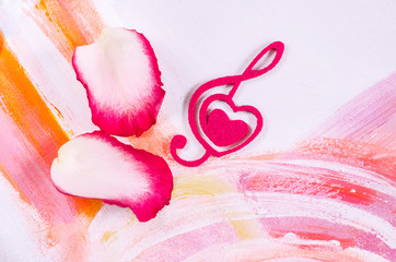 Rose with a decorative heart in the shape of a treble clef with pink felt.