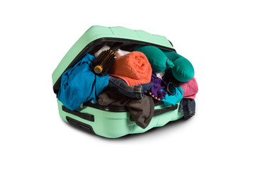 Plastic suitcase with wheels, overflowing things on a white background. Travel concept, vacation...