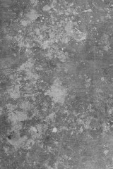 Black and white photo of old scratched linoleum spattered with white paint. Grunge texture background. Background for design