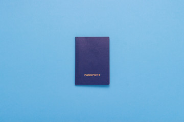 Passport on the Blue background. Minimalism style. The concept of Travel and Holidays. Flat lay, top view