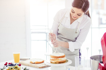chef using pastring bag while cooking, close up photo. copy space